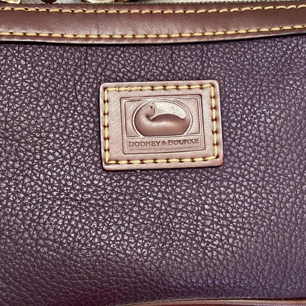 Dooney & Bourke pebbled deep purple and Brown Leather Wristlet, keychain
